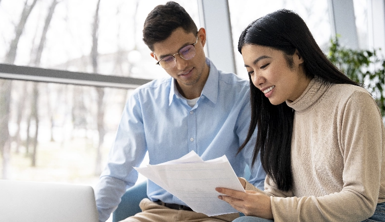 Couple checking what can get when borrowing from a licensed money lender