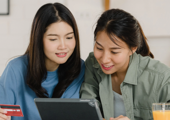 women checking how to engage in money lenders in Singapore